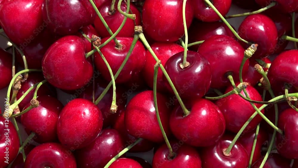 Organic ripe red cherry berry. Rotating turntable Organic ripe red cherry berry. Rotating turntable