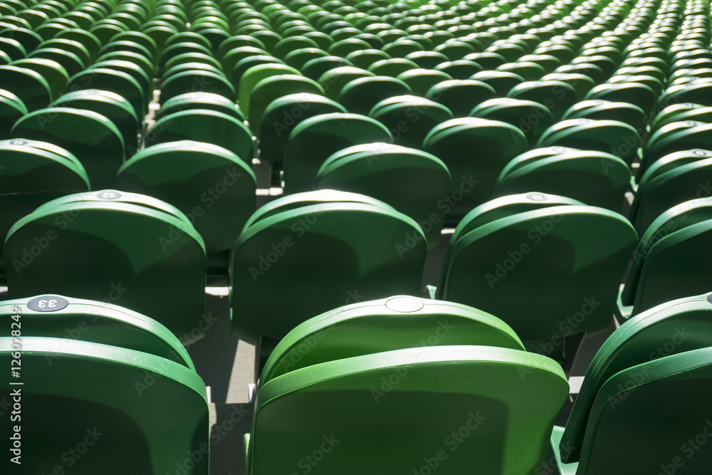 Fototapeta premium Seating rows in a stadium with weathered chairs