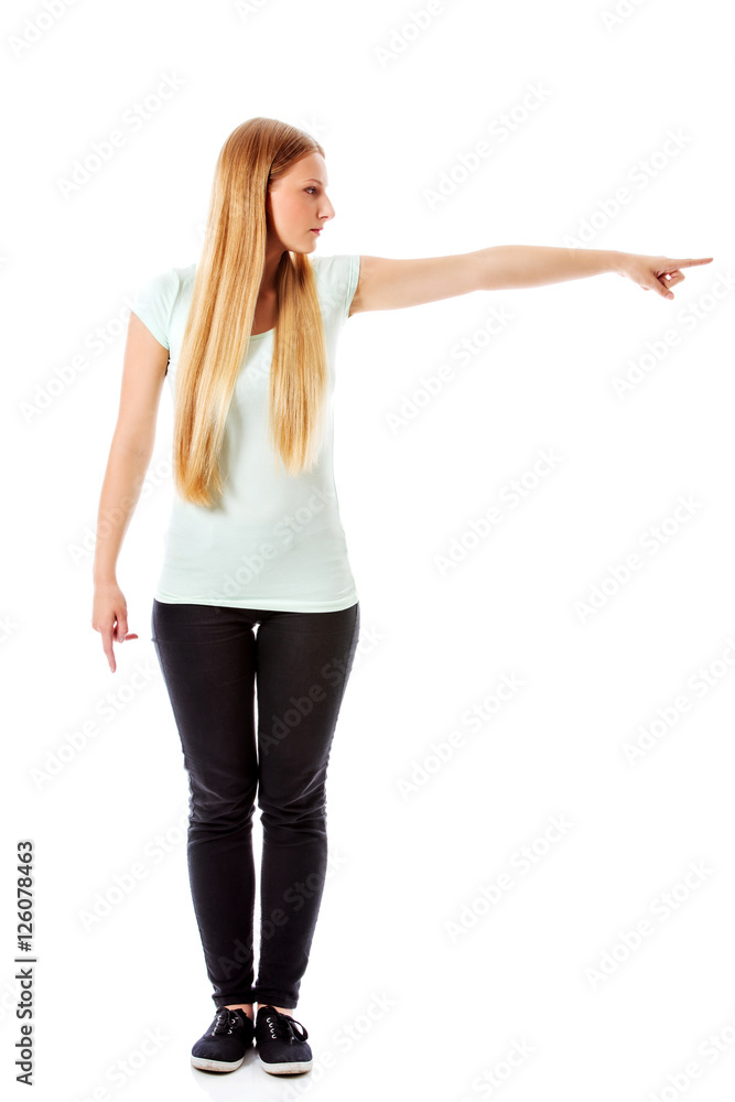 Attractive woman looking and pointing sideways. Attractive woman looking and pointing sideways.