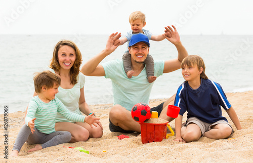 Parents with kids at seaside