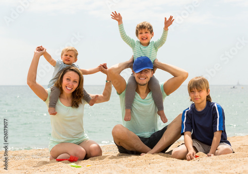 Parents with kids at seaside