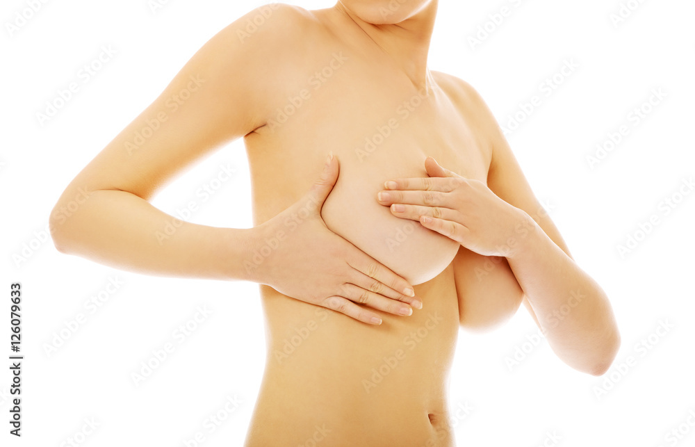 Woman examing her breast - breast cancer concept Woman examing her breast - breast cancer concept