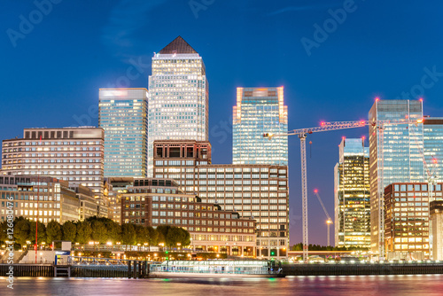 Night skyline of Canary Wharf. London buildings at sunset