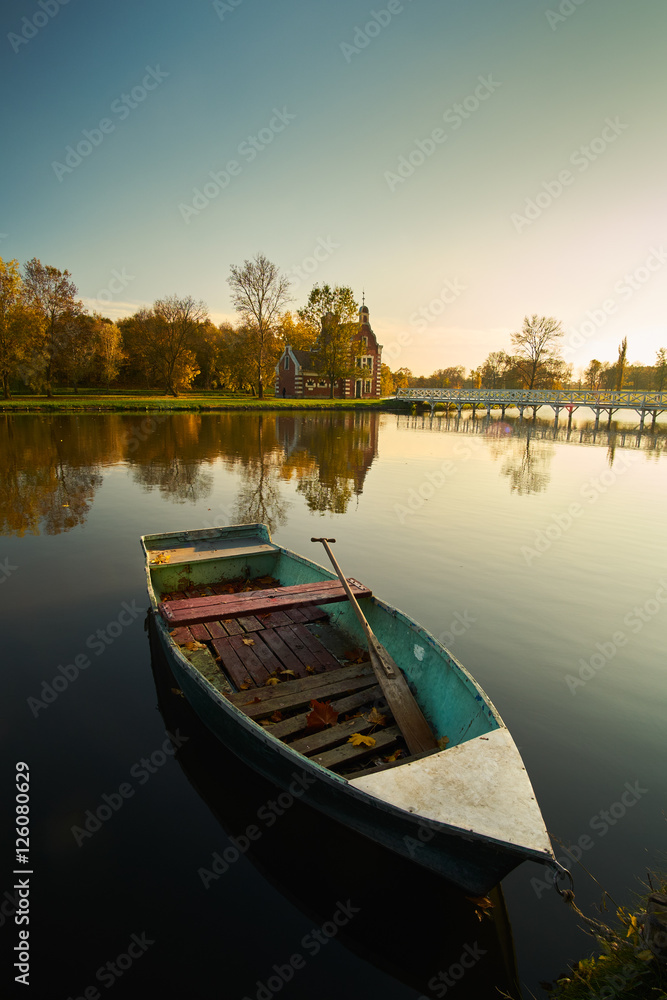 Boat on autumn lake