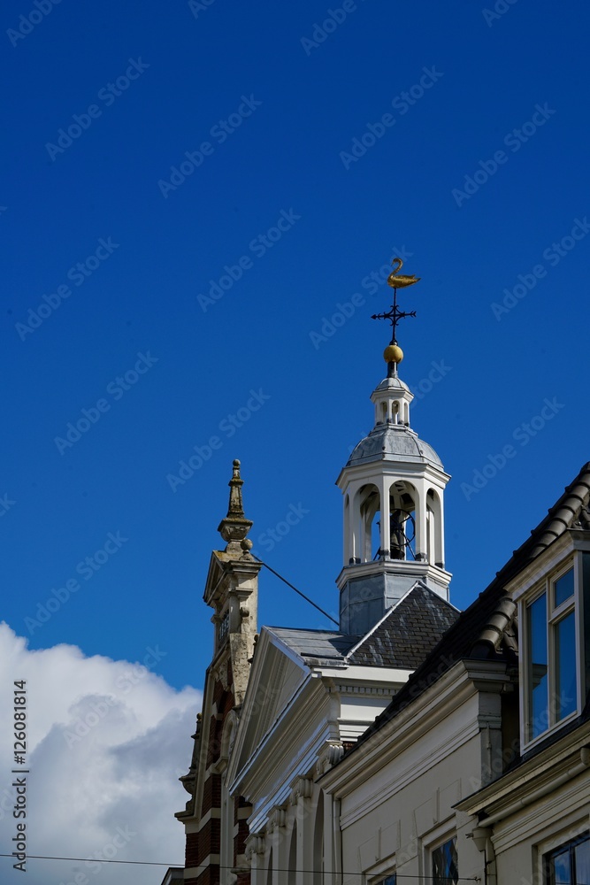 old steeple in front of a blue sky