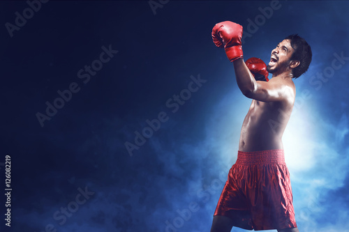 Portrait of happiness asian boxer man