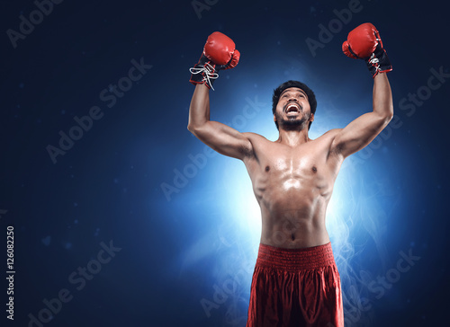 Asian boxer man with happy celebration © Leo Lintang