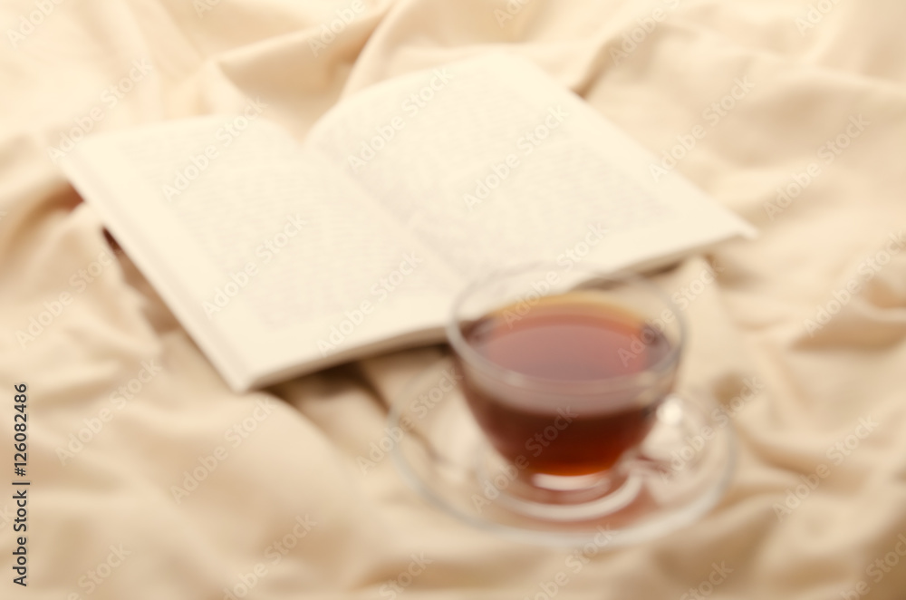 Black tea and book. Relaxing atmosphere. Black tea and book. Relaxing atmosphere.