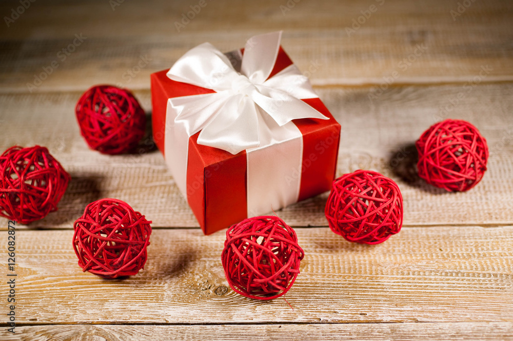 Christmas gift on a wooden background. Selective focus