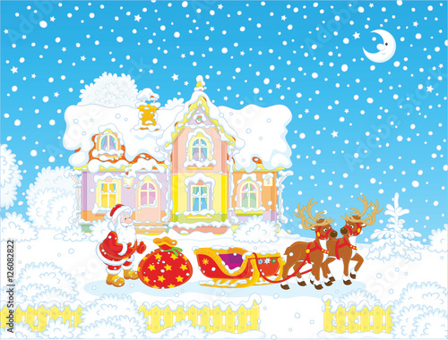 The night before Christmas, Santa Claus with a big bag of gifts preparing for a journey in his sleigh with reindeers