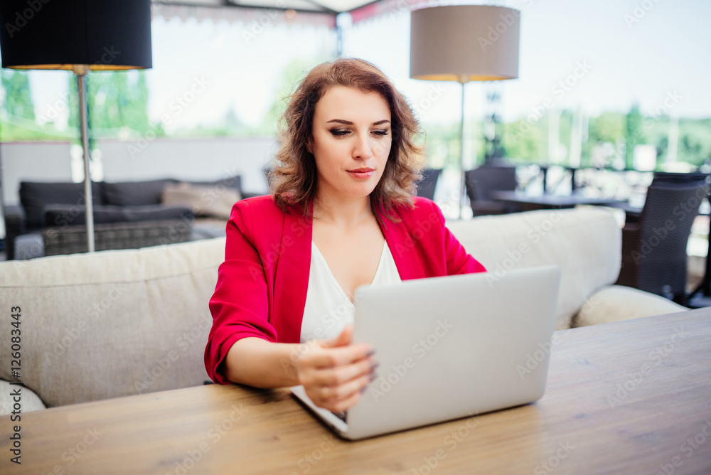 Cute woman successful business lady using laptop computer while Cute woman successful business lady using laptop computer while
