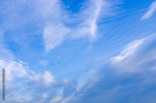 Blue sky with plane track