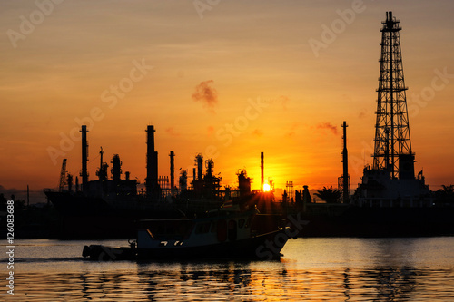 Oil refinery industry plant. Silhouette of oil refinery is locat © kriangphoto31