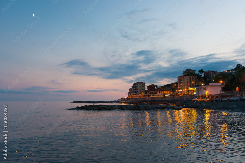 Vacation on the Mediterranean coast. Coast Italy. Liguria night. Summer evening.