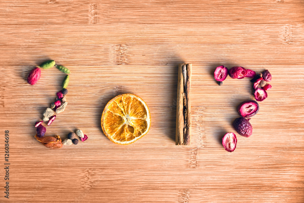 Obraz premium 2017 written with spices on wooden background, food 2017 new year concept