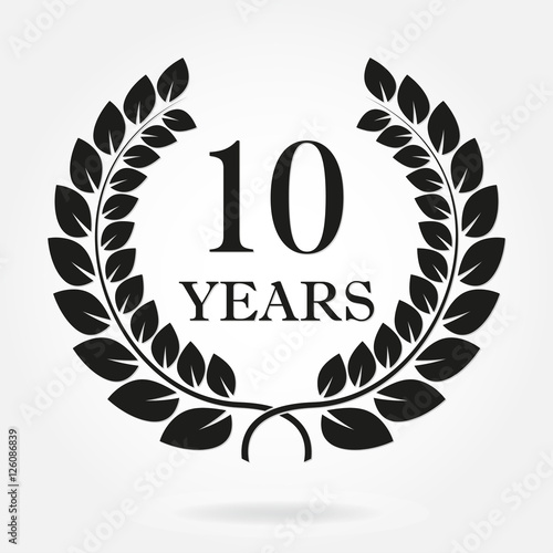 10 years anniversary laurel wreath sign or emblem. Template for celebration and congratulation design. Vector 10th anniversary label isolated on white background.