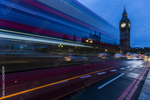 London, England, UK. Red buses blured in motion on Westminster b