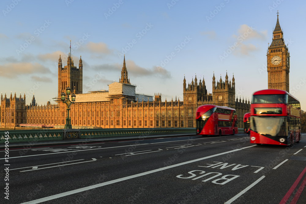 London, England, UK. Red buses blured in motion on Westminster b