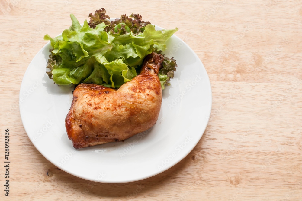 homemade grilled chicken and salad on wooden table homemade grilled chicken and salad on wooden table