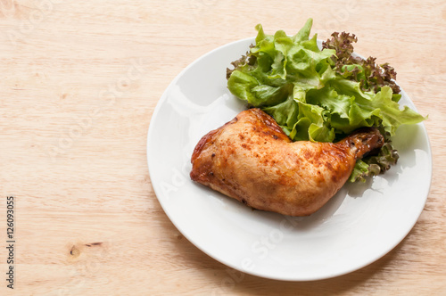 homemade grilled chicken and salad on wooden table