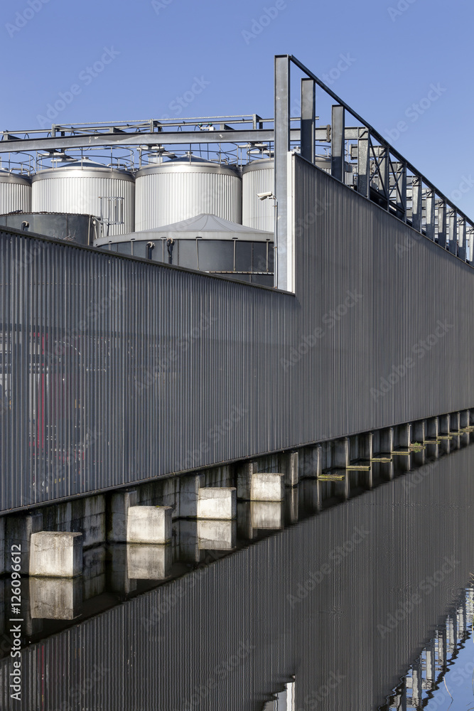 Industrial security fence and storage tanks