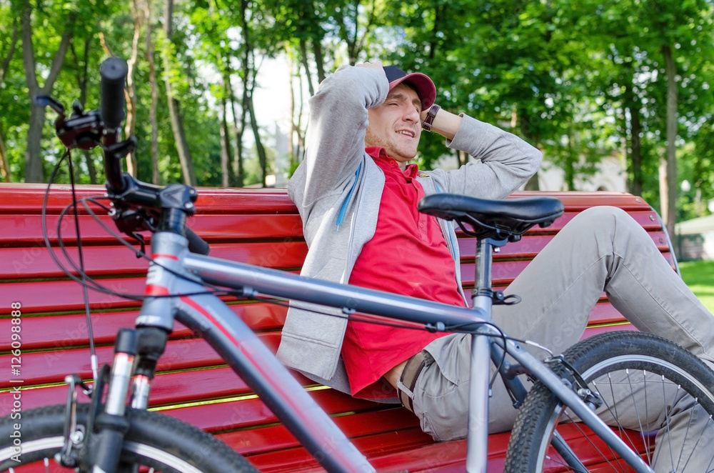 Obraz premium Young man with bicycle