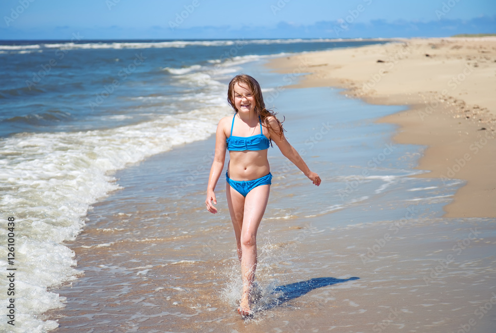 Fototapeta premium young girl on a beach