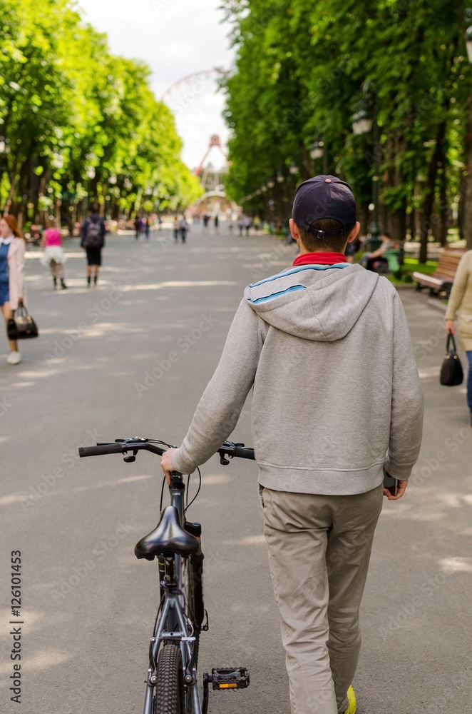 Naklejka premium Young man with bicycle
