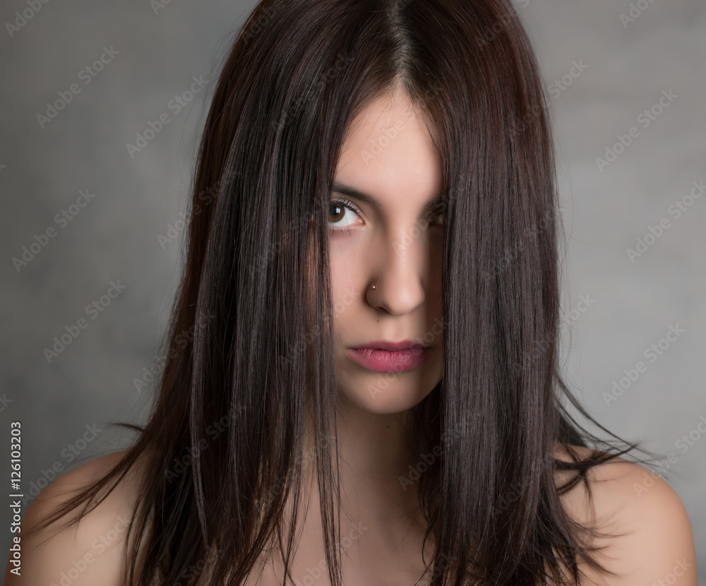 Fototapeta premium Portrait of beautiful sensual woman, close-up. Studio shot.