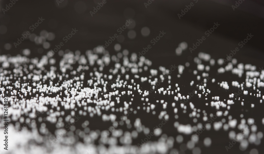 Salt sprinkled on a glass table Salt sprinkled on a glass table