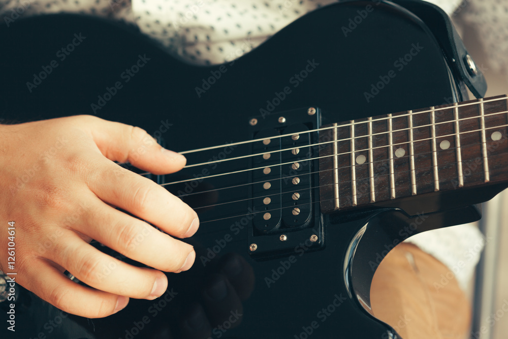 Fototapeta premium man playing electric guitar