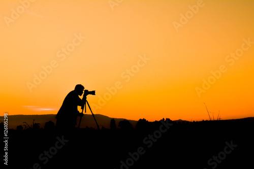 Silhouette of man photograph nature at sky sunrise in the morning