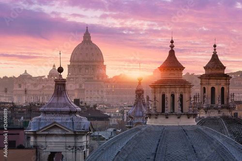 Italy, skyline of Rome at sunset with St peter's Cathedral