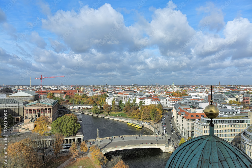 Fototapeta premium North view of Berlin from viewing gallery around the dome of Berlin Cathedral in autumn day, Germany. The foreground shows Friedrichs Bridge crossing the Spree between Museum Island and the mainland.