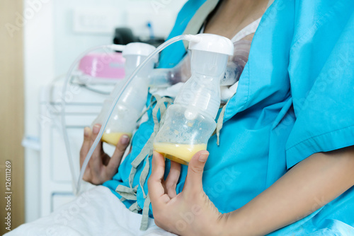woman pumped breast milk from the breast.