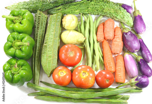 Fresh organic vegetables on a white background.