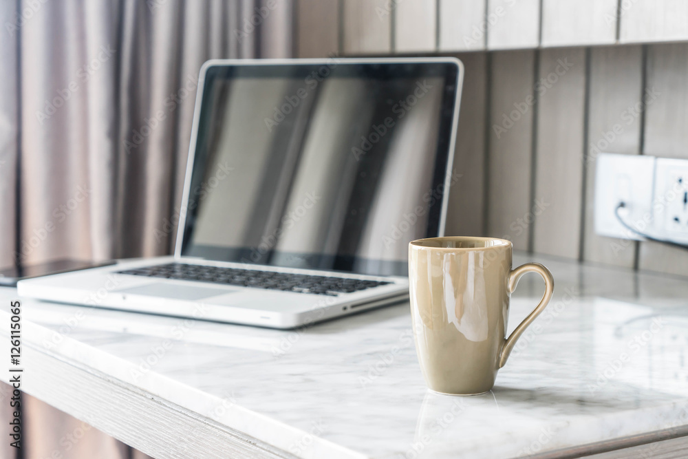 coffee cup with laptop and beautiful luxury table decoration in coffee cup with laptop and beautiful luxury table decoration in