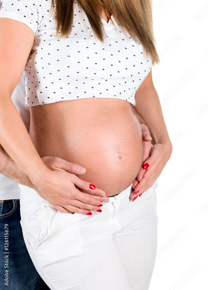Pregnant young woman with man in studio Pregnant young woman with man in studio