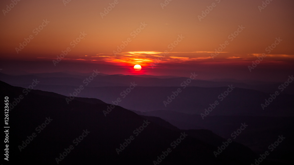 A beautiful view of the sunset in mountains