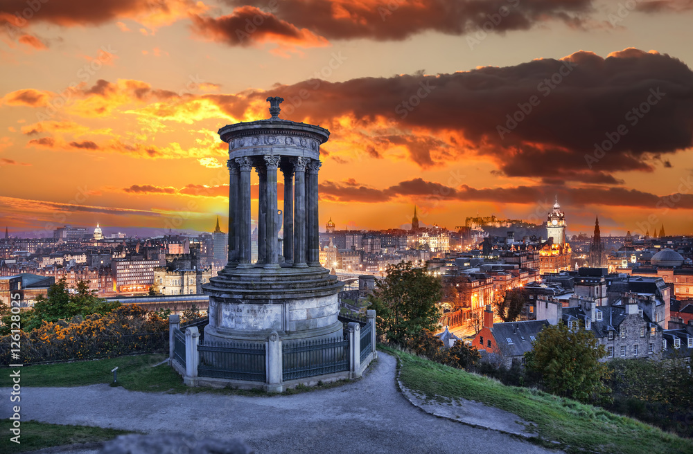 Fototapeta premium Edinburgh against sunset with Calton Hill in Scotland
