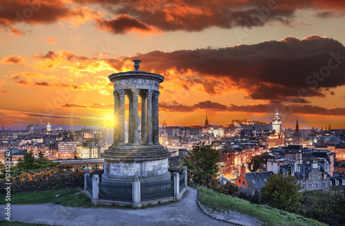 Fototapeta Naklejka Na Ścianę i Meble -  Edinburgh against sunset with Calton Hill in Scotland