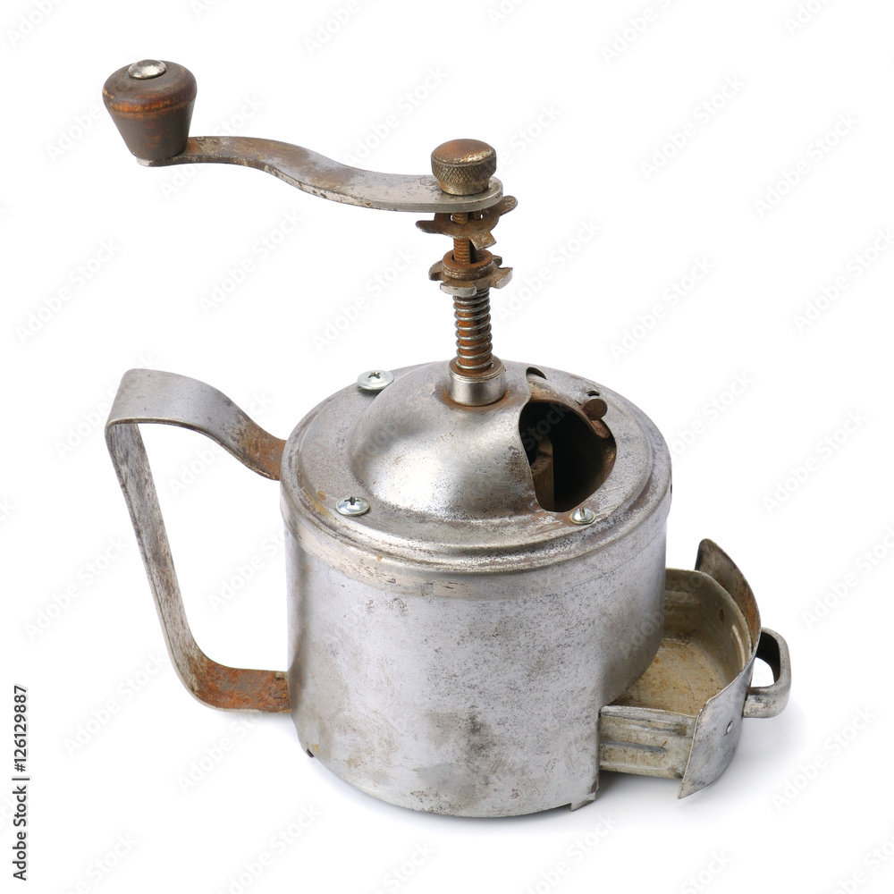 old hand a coffee grinder isolated on white background old hand a coffee grinder isolated on white background