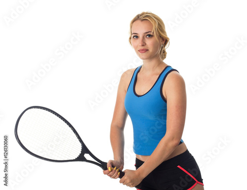 Young woman with the tennis racket