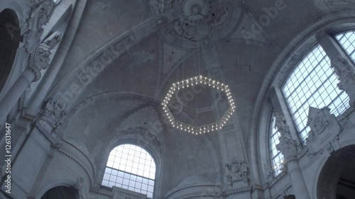 New Town Hall in Hanover, Germany. Tilt from the ceiling of the dome with it's dome lamp in 4K and S-Log3. Long shot. Autumn. Neues Rathaus Hannover.