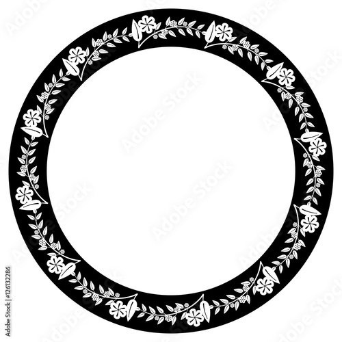 Black and white round frame with floral silhouettes. 