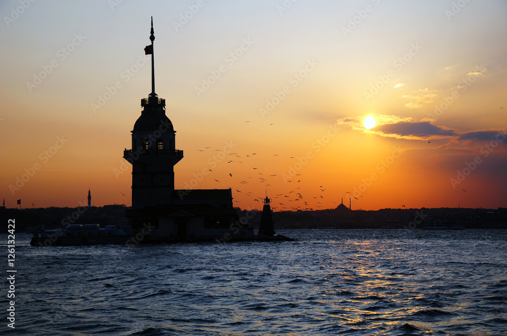 Mainden tower on the small island in Istanbul. Nice sunset on a calm bosphorus channel.