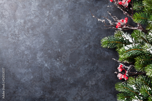 Christmas stone background with snow fir tree