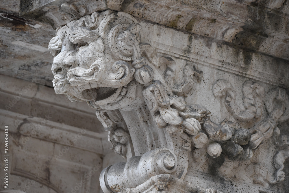 Ornamental statue under a balcony, Ascoli Piceno, Italy