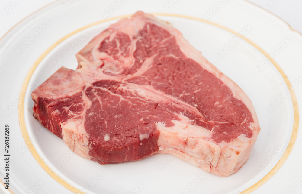 T-bone steak in a rustic plate