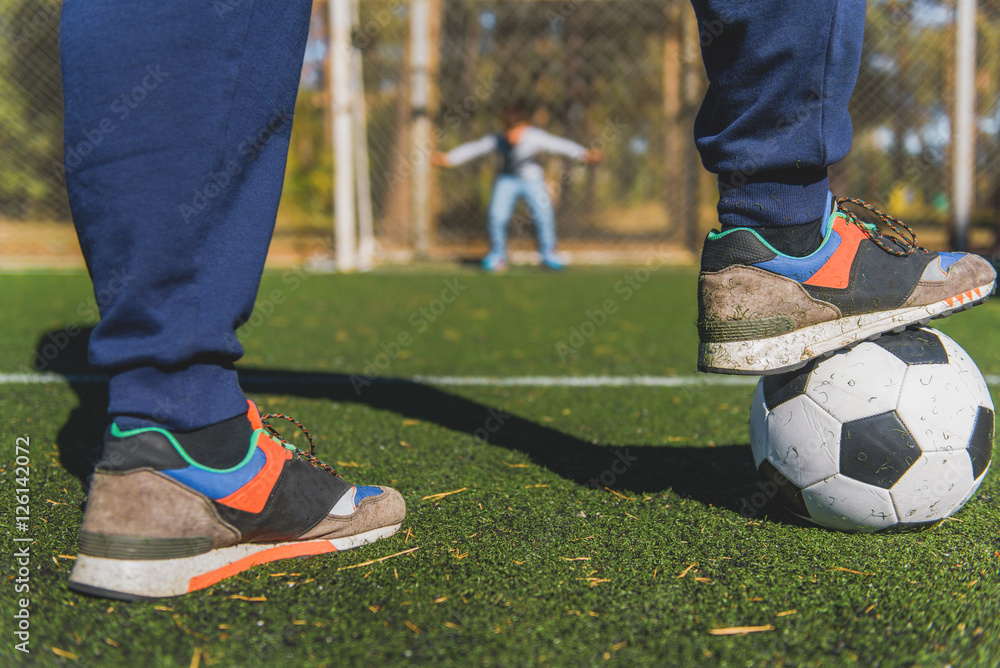 Obraz premium Father and son playing football